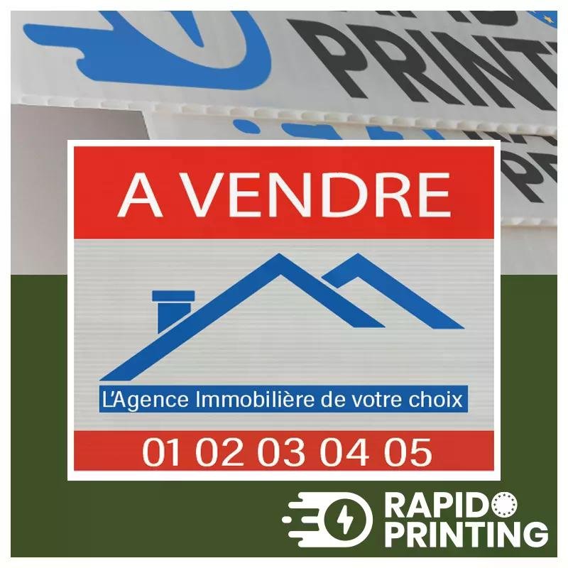 Affiche publicitaire « A VENDRE » avec icône de maison bleue et texte immobilier, superposé sur fond publicitaire Rapidoprinting.